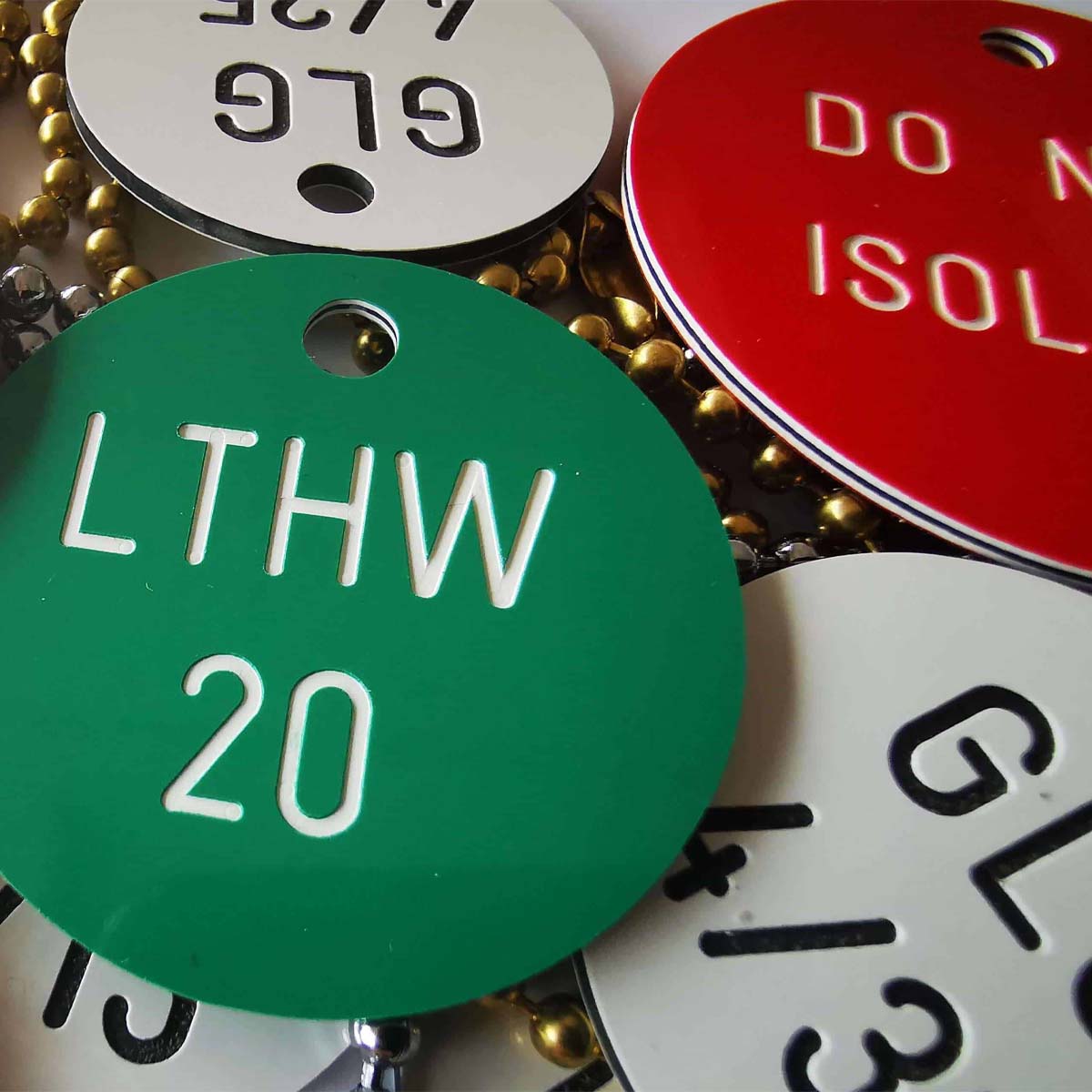 A variety of round valve tags